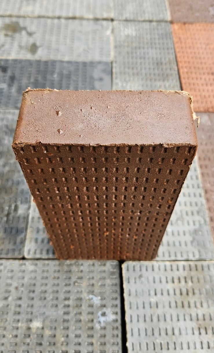 Interlocking pavers being installed on a prepared surface