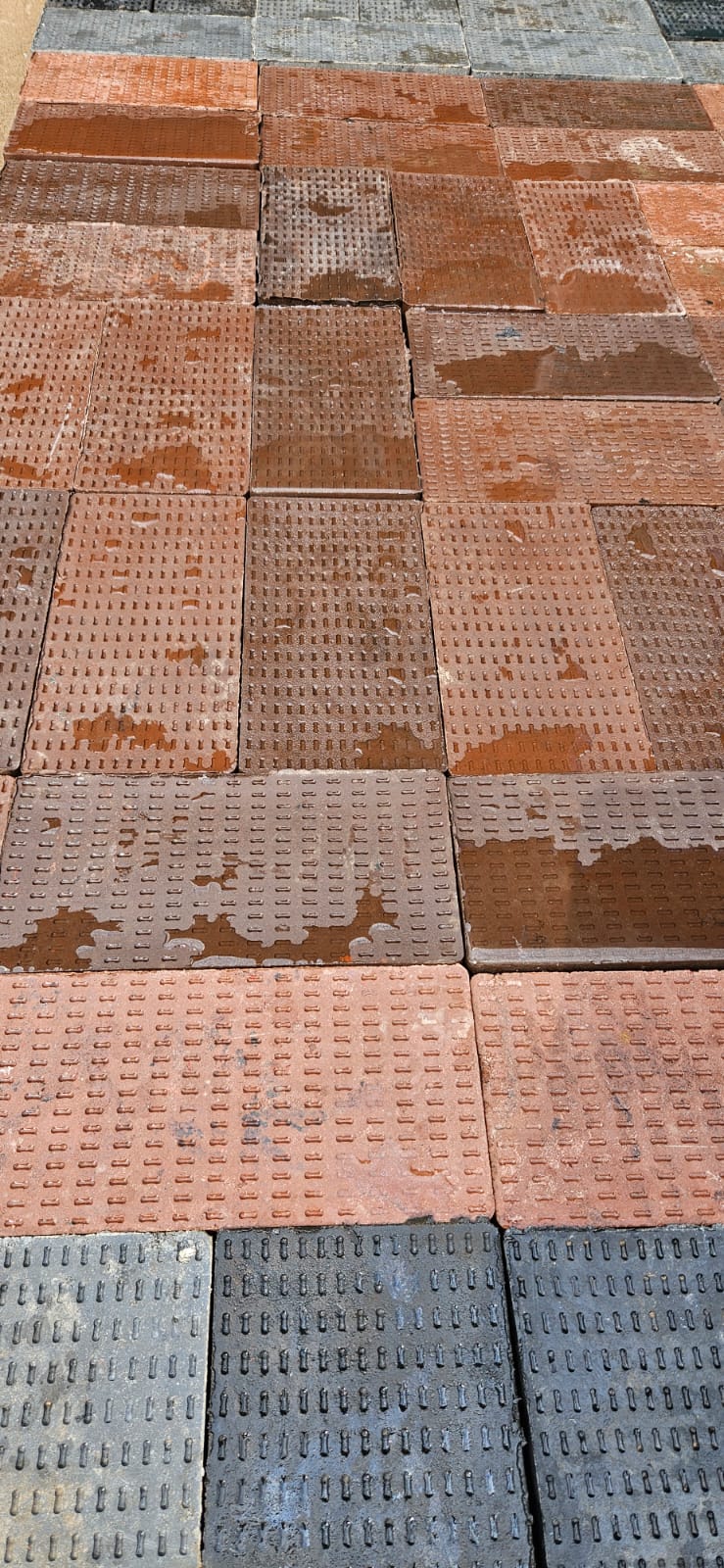 Interlocking pavers close-up showing surface finish and colour